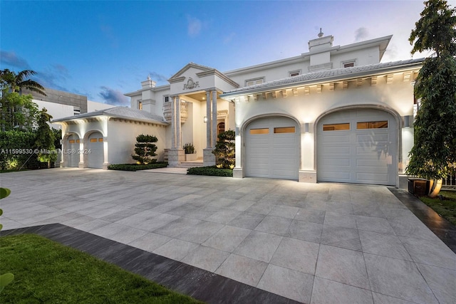 mediterranean / spanish house featuring a garage