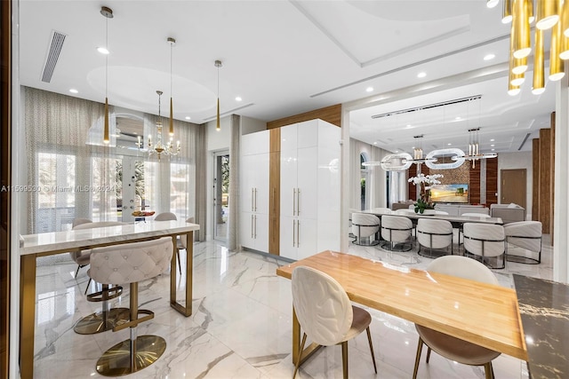 dining area featuring french doors, an inviting chandelier, and a wealth of natural light