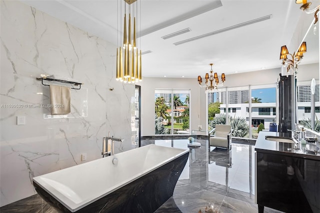 kitchen featuring a chandelier, tile walls, and sink