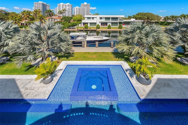 view of pool featuring a lawn