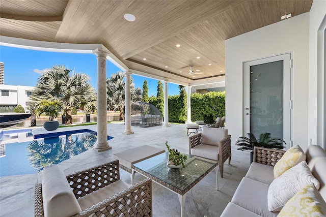 view of patio with an outdoor hangout area and ceiling fan