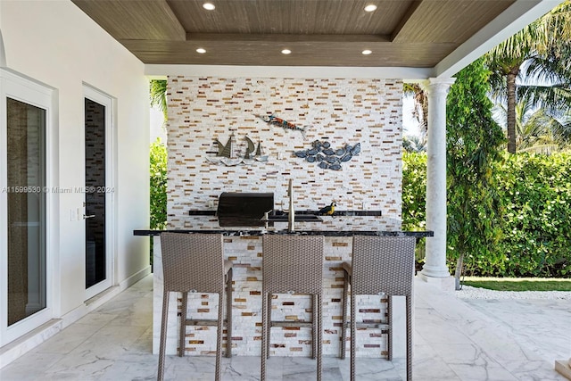 view of patio with exterior kitchen