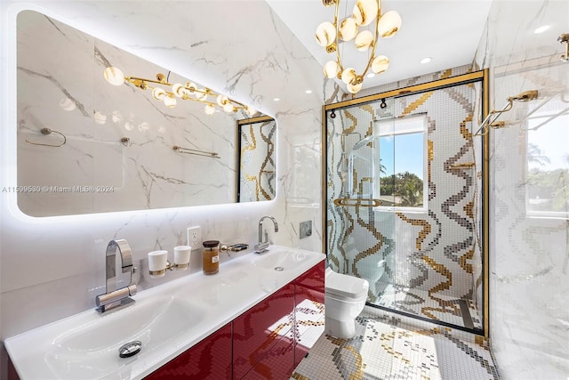 bathroom with a notable chandelier, toilet, decorative backsplash, vanity, and tile walls