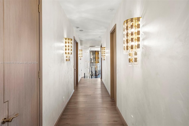 hallway with light hardwood / wood-style floors