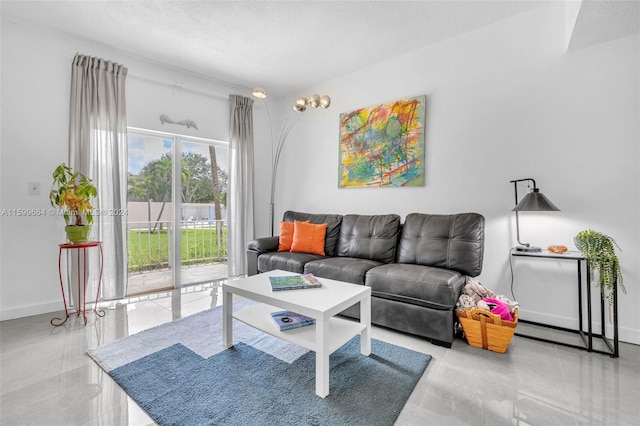 living room featuring a textured ceiling