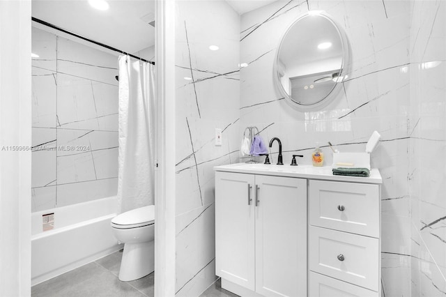 full bathroom featuring tile patterned flooring, toilet, tile walls, shower / bath combination with curtain, and vanity