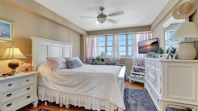 bedroom featuring ceiling fan and dark hardwood / wood-style floors