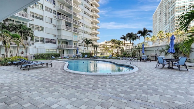 view of swimming pool with a patio area