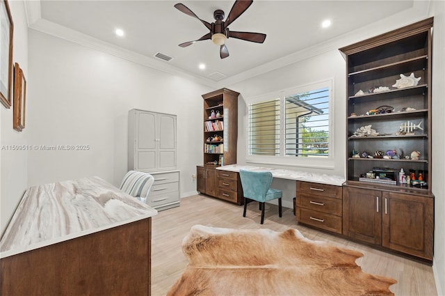 office featuring ceiling fan, ornamental molding, and light hardwood / wood-style floors