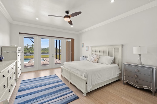 bedroom featuring crown molding, access to exterior, and light hardwood / wood-style flooring