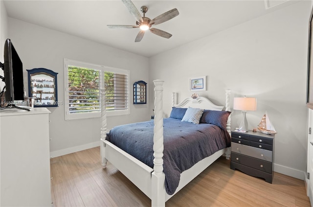 bedroom with ceiling fan and wood-type flooring