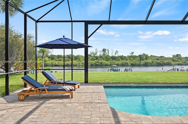 view of swimming pool featuring a water view, a yard, a lanai, and a patio