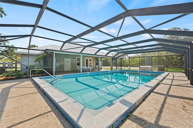 view of pool with a patio area, a lanai, and a hot tub