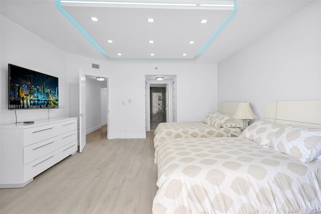 9455 Collins Ave Unit 809, Surfside, FL 33154 - bedroom with visible vents, baseboards, recessed lighting, a raised ceiling, and light wood finished floors