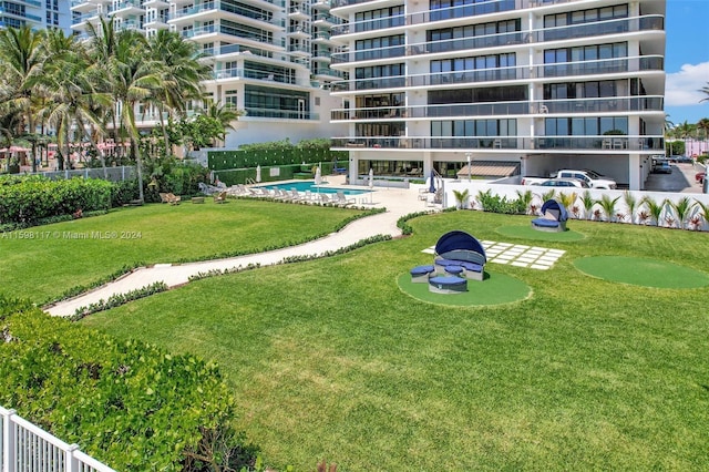 9455 Collins Ave Unit 809, Surfside, FL 33154 - view of property's community with fence and a swimming pool
