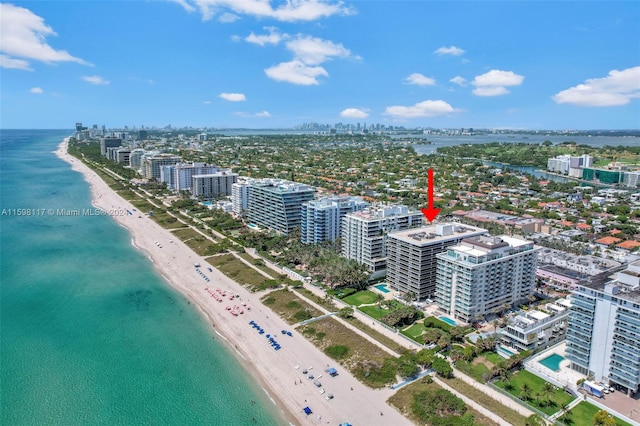 drone / aerial view with a view of the beach and a water view