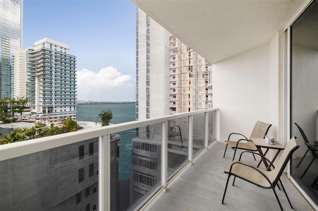 balcony featuring a water view