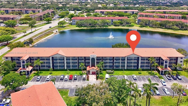 birds eye view of property featuring a water view