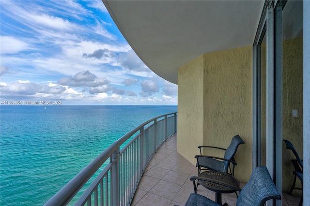 balcony featuring a water view