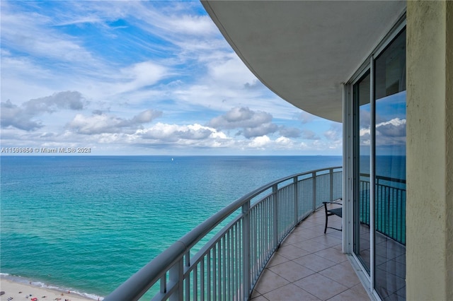 balcony featuring a water view