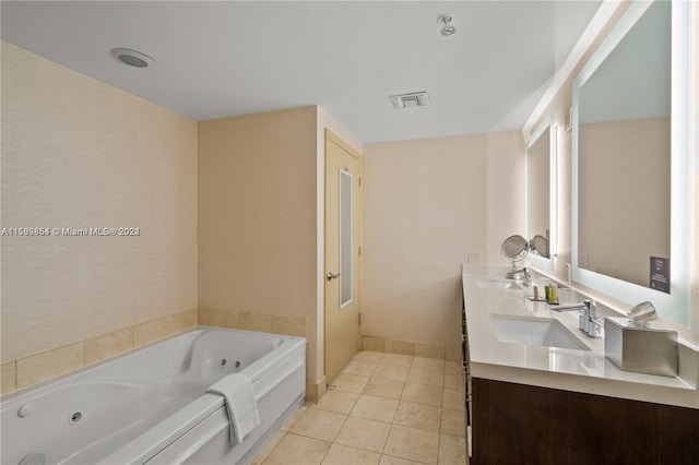 bathroom featuring a whirlpool tub, visible vents, a sink, and tile patterned floors