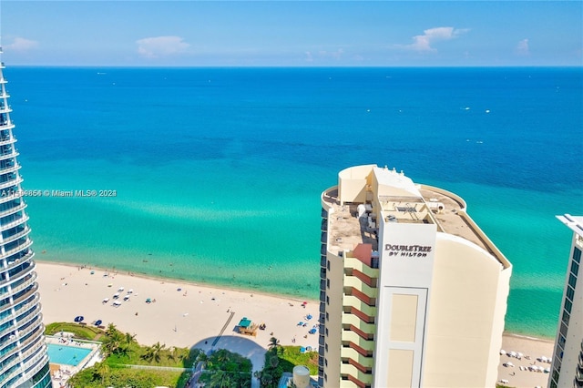 aerial view with a water view and a view of the beach