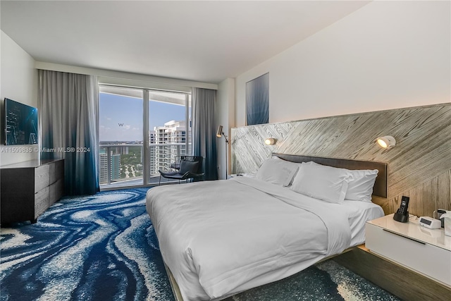 bedroom featuring carpet flooring and wooden walls