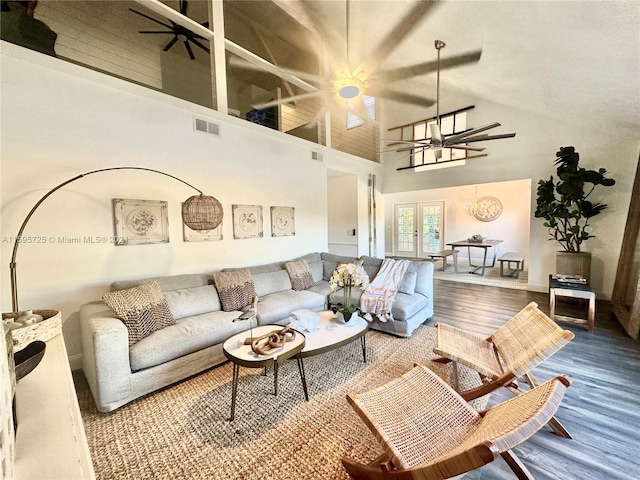 living room with high vaulted ceiling, hardwood / wood-style flooring, and ceiling fan