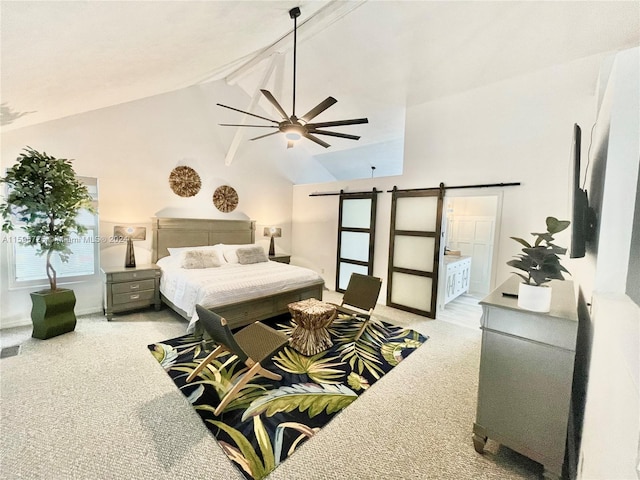 carpeted bedroom featuring beamed ceiling, a barn door, high vaulted ceiling, ensuite bathroom, and ceiling fan