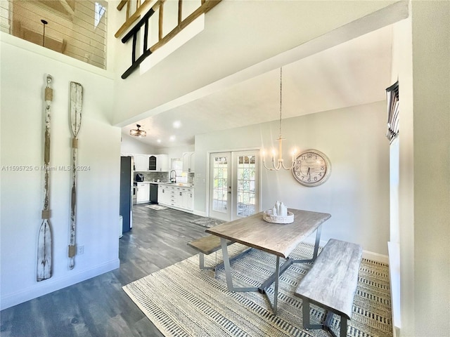 dining space featuring high vaulted ceiling, french doors, sink, and dark hardwood / wood-style flooring