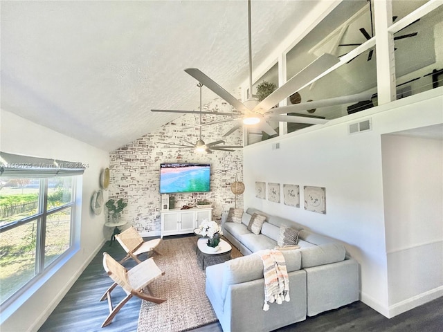 living room with brick wall, ceiling fan, a textured ceiling, and dark hardwood / wood-style floors