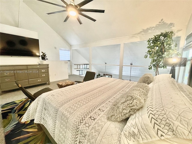 carpeted bedroom with ceiling fan, multiple windows, and lofted ceiling