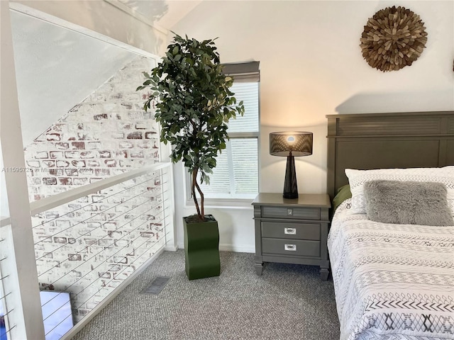 carpeted bedroom featuring vaulted ceiling