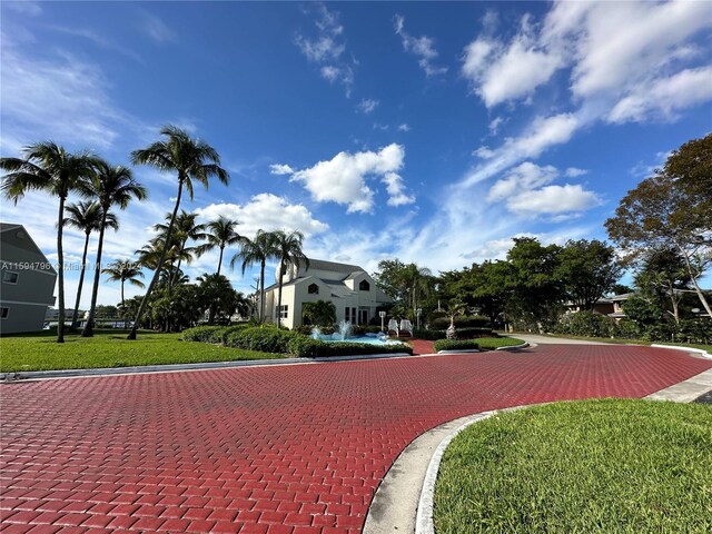 surrounding community featuring a lawn