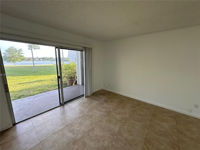 empty room with a textured ceiling