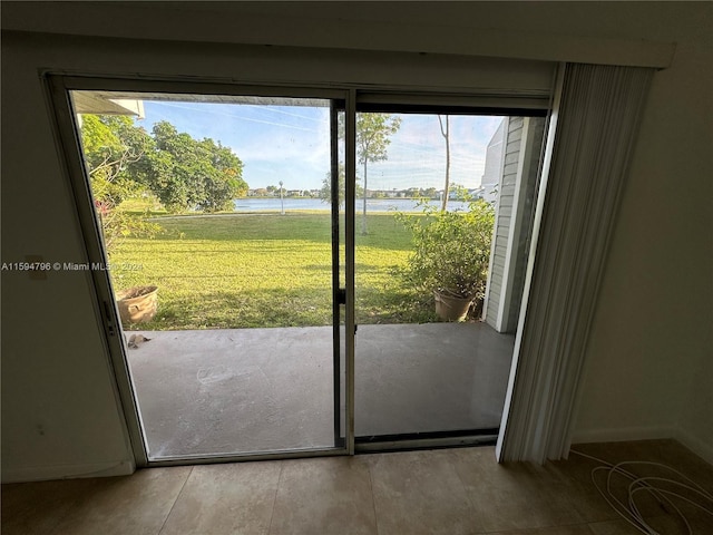 doorway to outside featuring a water view