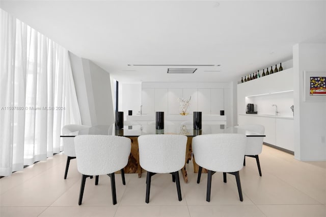 dining area featuring light tile floors