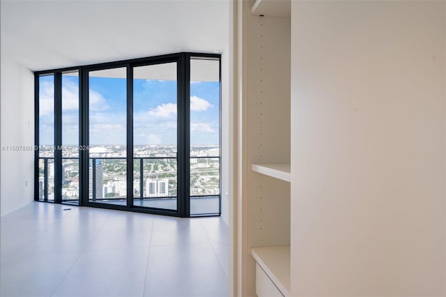 interior space featuring tile floors, a wealth of natural light, and expansive windows