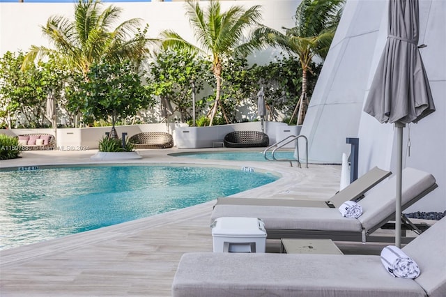 view of swimming pool with a patio area