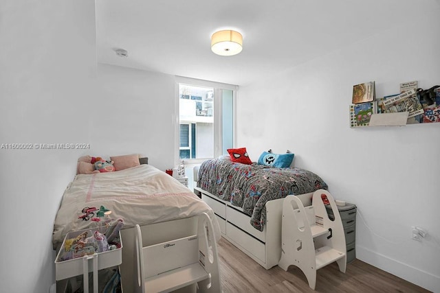 bedroom featuring hardwood / wood-style floors