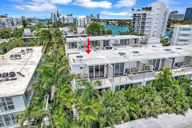 birds eye view of property featuring a water view