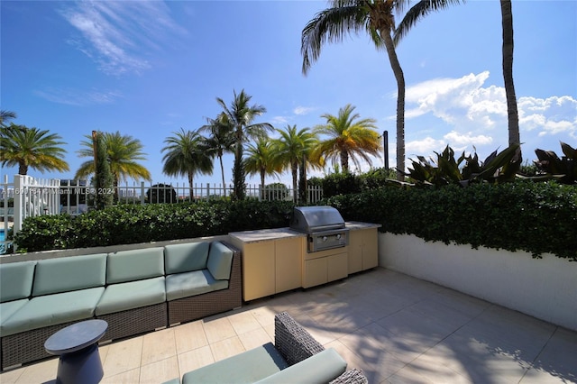 view of patio featuring a grill, area for grilling, fence, and an outdoor hangout area