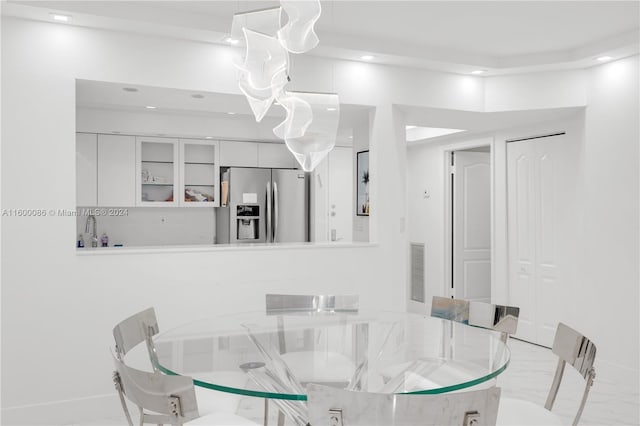 dining area featuring light tile patterned floors