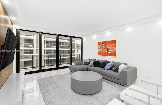 living room featuring expansive windows and light tile patterned flooring