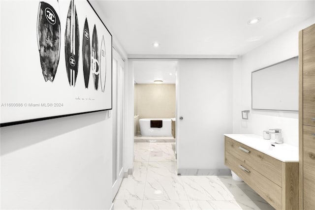 bathroom featuring tile patterned flooring and vanity