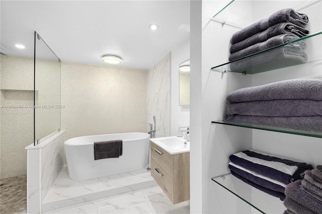 bathroom featuring vanity, independent shower and bath, and tile patterned floors