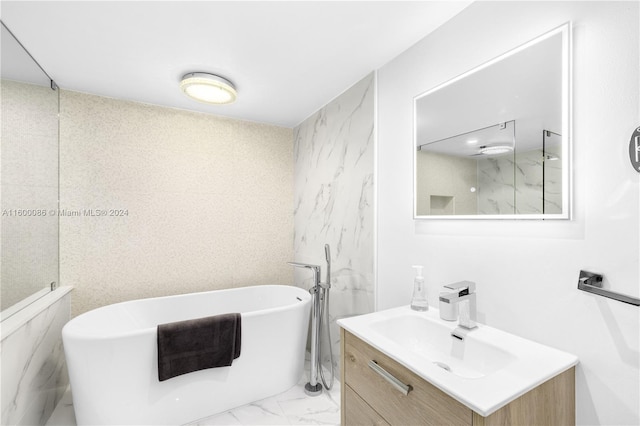 bathroom with tile patterned floors, separate shower and tub, and vanity