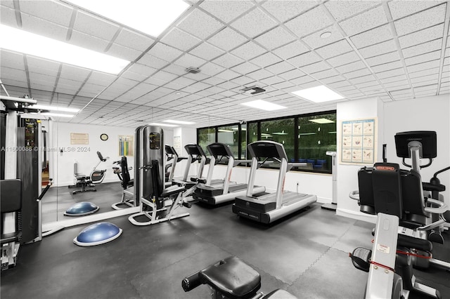 exercise room featuring a drop ceiling