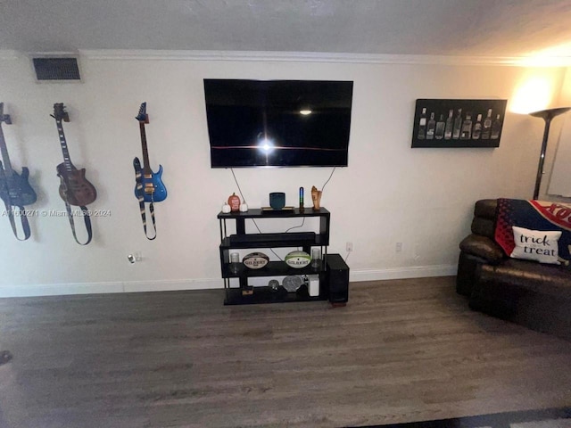 living room with ornamental molding and dark hardwood / wood-style floors