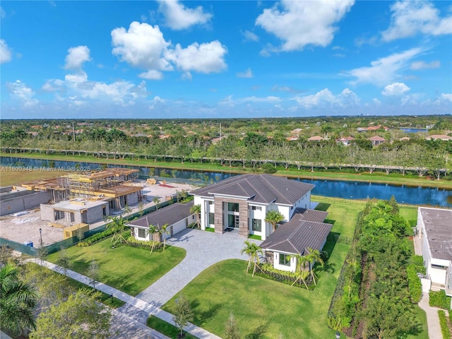 birds eye view of property with a water view